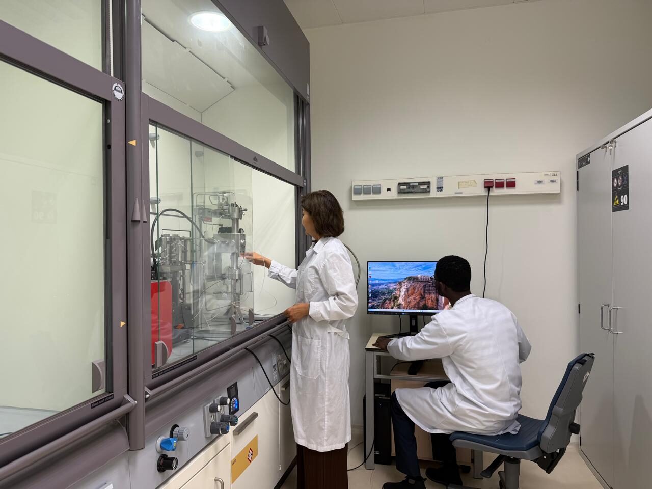 Researchers operating a continuous-flow setup in the TEQ R&D Laboratory